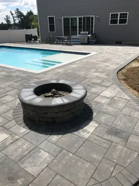 Pool patio with stone firepit