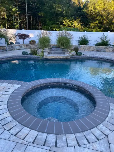 Pool with spa and paver edging